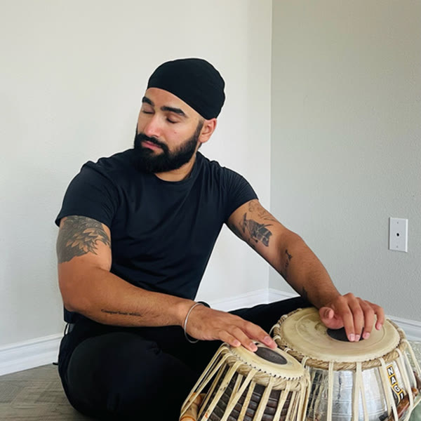 Inder playing tabla for DJ Jazz Entertainment